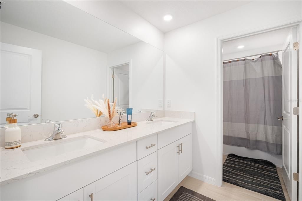 Bathroom, Dual Sink Vanities, Glass Shower, Interior, Recessed Lighting, Wood Texture Flooring