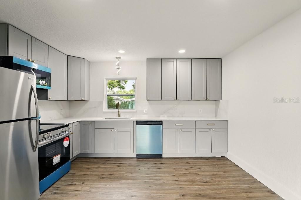 Interior, Kitchen, Recessed Lighting, Stainless Steel Appliances, Wood Texture Flooring