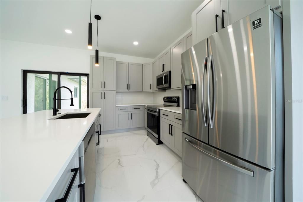 Interior, Kitchen, Marble, Pendant Lights, Recessed Lighting, Stainless Steel Appliances