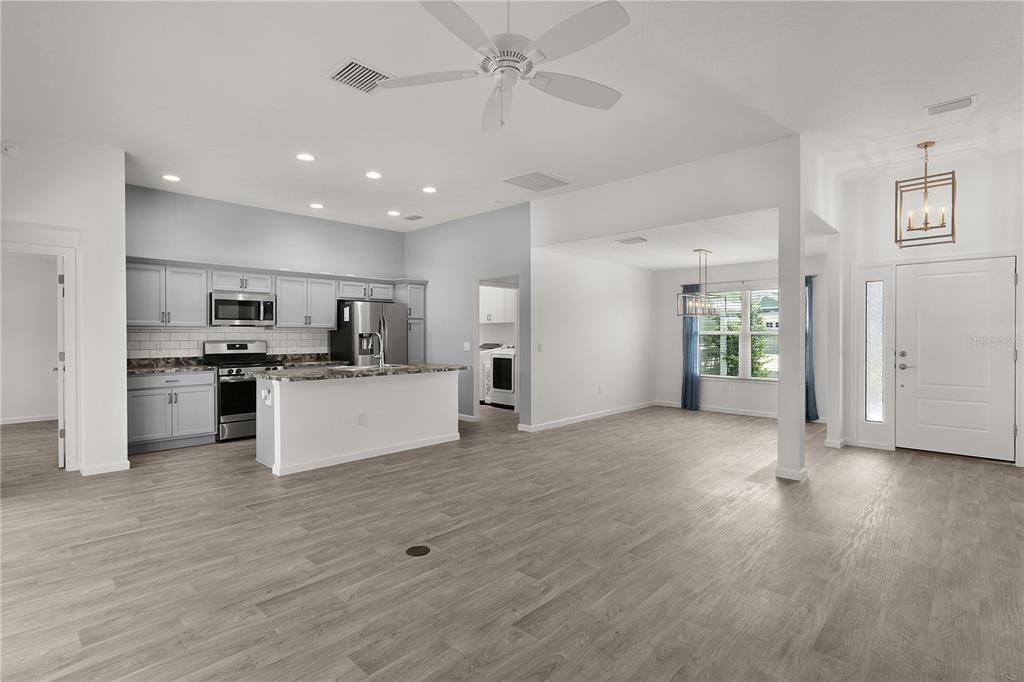 Empty room, Interior, Kitchen, Pendant Lights, Recessed Lighting, Stainless Steel Appliances, Wood Texture Flooring