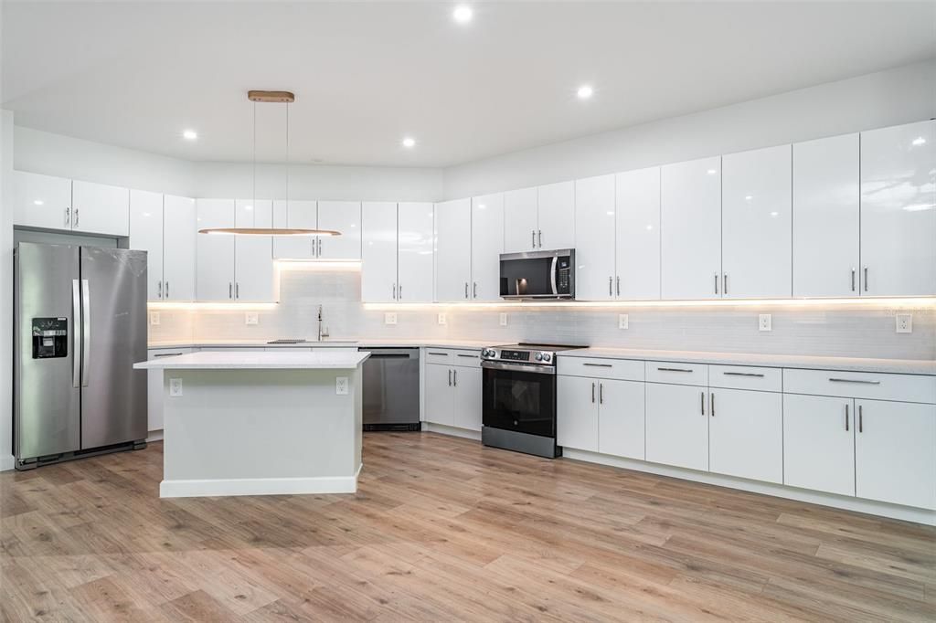 Interior, Kitchen, Pendant Lights, Recessed Lighting, Stainless Steel Appliances, Wood Texture Flooring