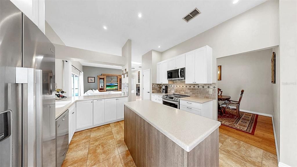 Dining room, Interior, Kitchen, Recessed Lighting, Stainless Steel Appliances, Wood Texture Flooring
