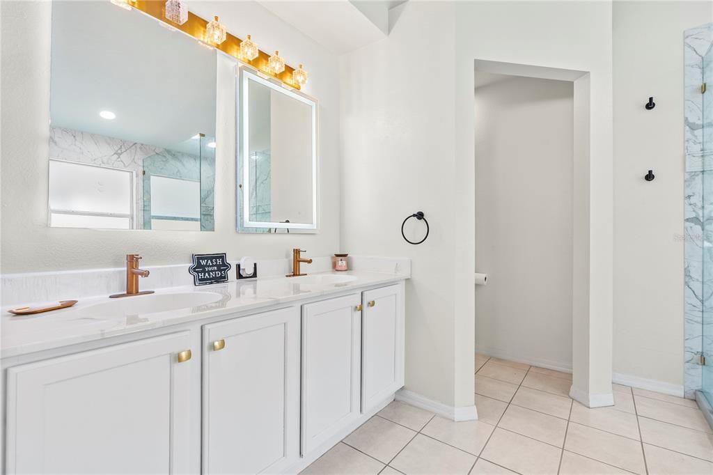 Bathroom, Dual Sink Vanities, Glass Shower, Interior, Marble Walls, Recessed Lighting