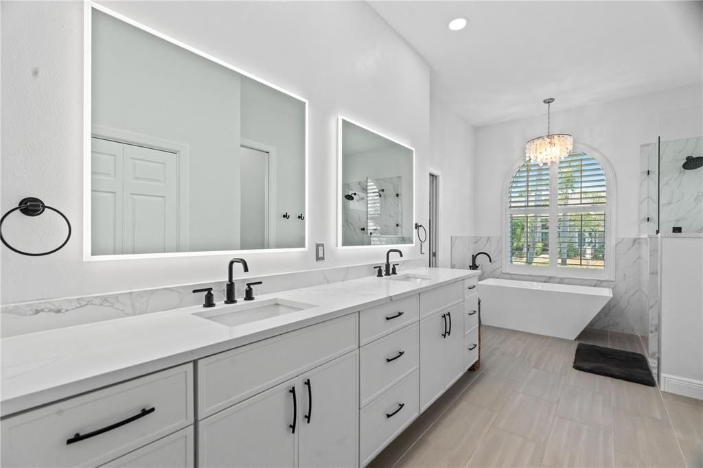 Bathroom, Chandelier, Dual Sink Vanities, Free Standing Baths, Interior, Marble, Marble Walls, Recessed Lighting