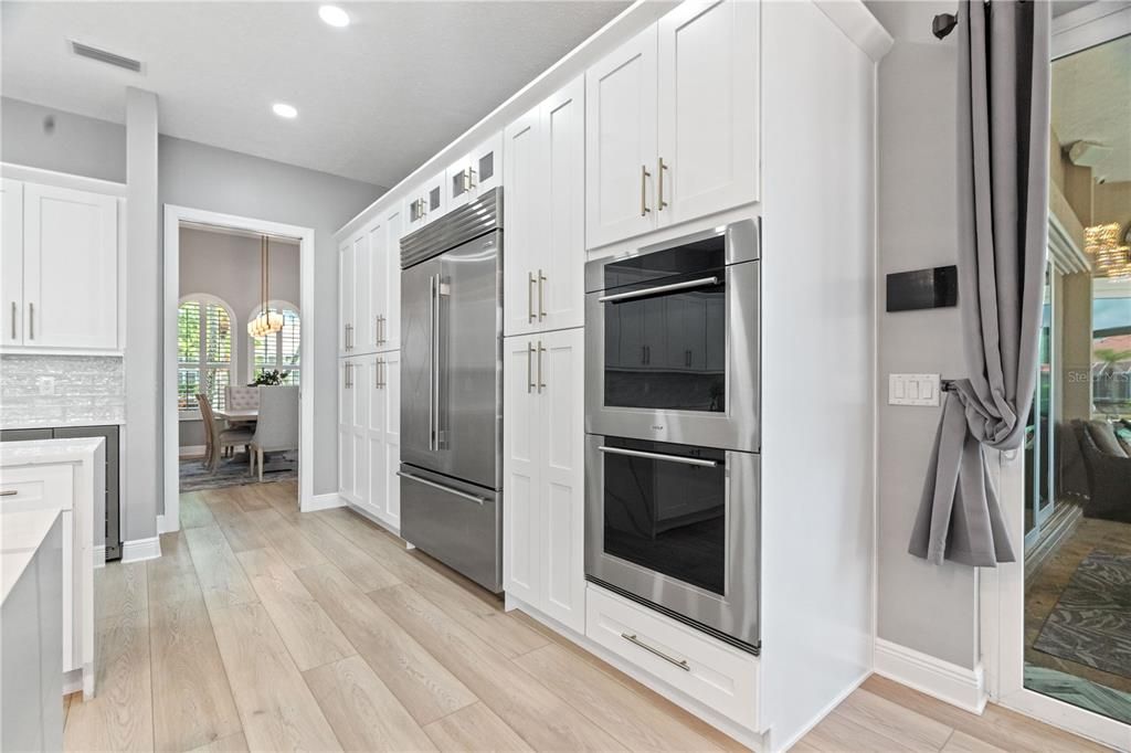 Chandelier, Dining room, Interior, Kitchen, Pendant Lights, Recessed Lighting, Stainless Steel Appliances, Wood Texture Flooring