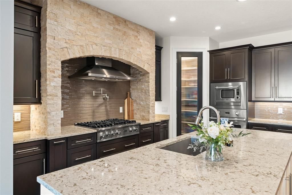 Interior, Kitchen, Recessed Lighting, Stainless Steel Appliances, Stone Walls