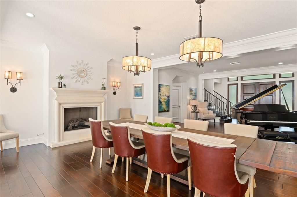 Chandelier, Dining room, Fireplace, Interior, Piano, Recessed Lighting, Wood Texture Flooring