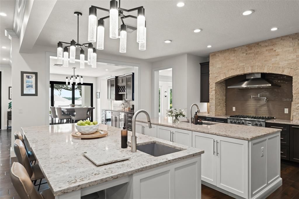 Chandelier, Dining room, Interior, Kitchen, Pendant Lights, Recessed Lighting, Stainless Steel Appliances, Stone Walls, Wood Texture Flooring