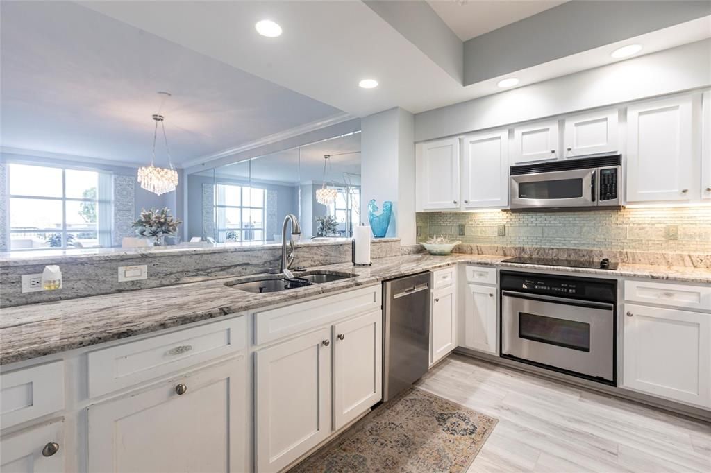 Chandelier, Interior, Kitchen, Recessed Lighting, Stainless Steel Appliances, Wood Texture Flooring