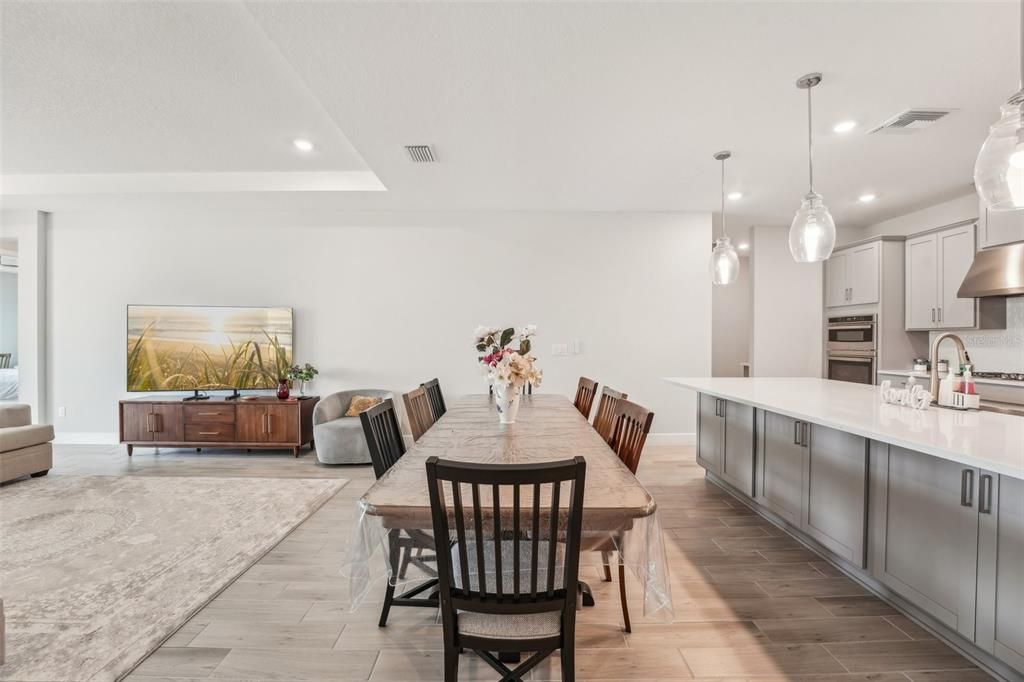 Dining room, Interior, Kitchen, Living room, Pendant Lights, Recessed Lighting, Stainless Steel Appliances, Wood Texture Flooring