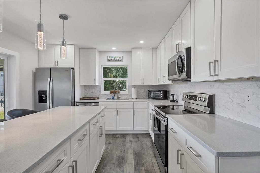 Interior, Kitchen, Pendant Lights, Recessed Lighting, Stainless Steel Appliances, Wood Texture Flooring