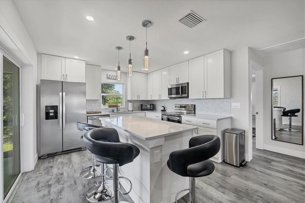 Interior, Kitchen, Pendant Lights, Recessed Lighting, Stainless Steel Appliances, Wood Texture Flooring