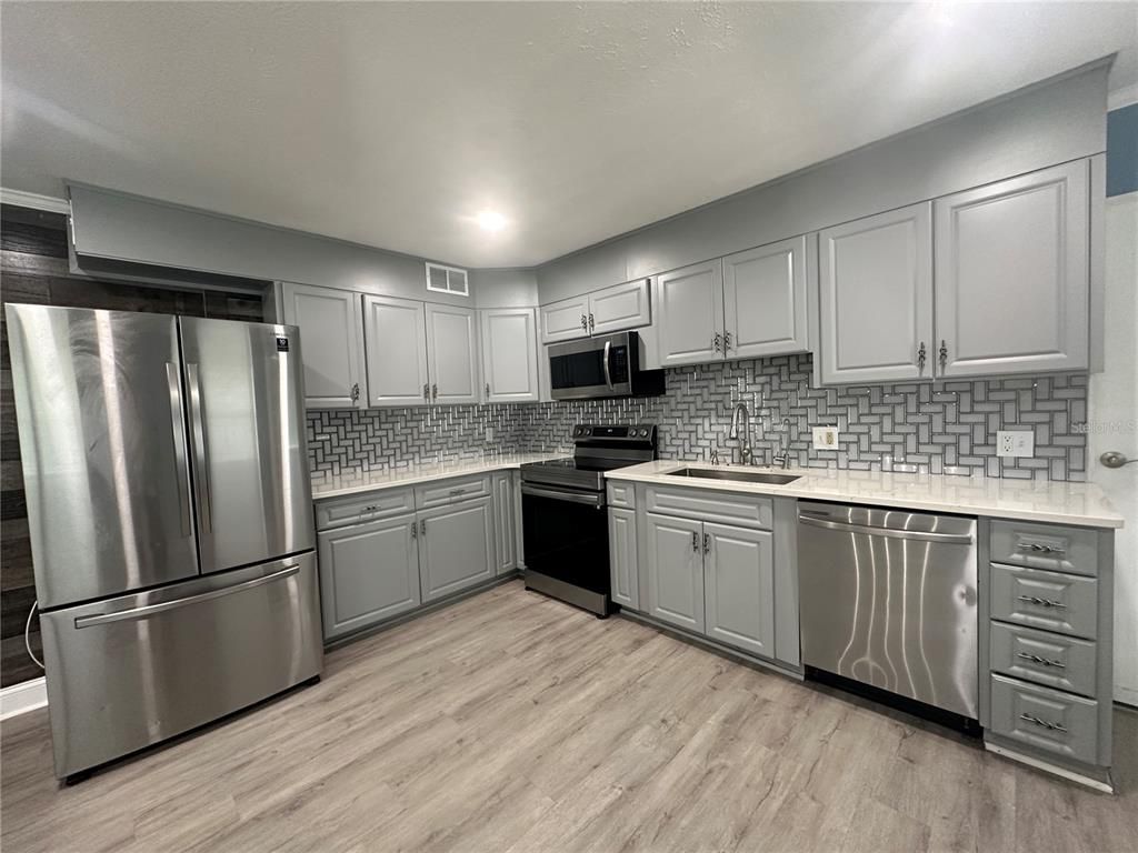 Interior, Kitchen, Recessed Lighting, Stainless Steel Appliances, Wood Texture Flooring
