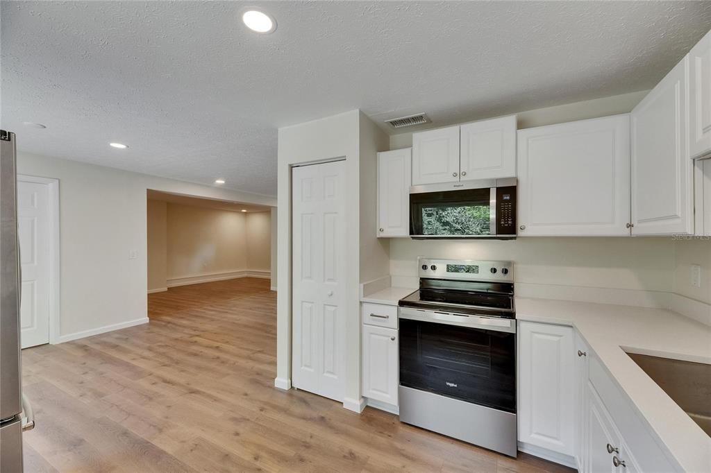 Interior, Kitchen, Recessed Lighting, Stainless Steel Appliances, Wood Texture Flooring