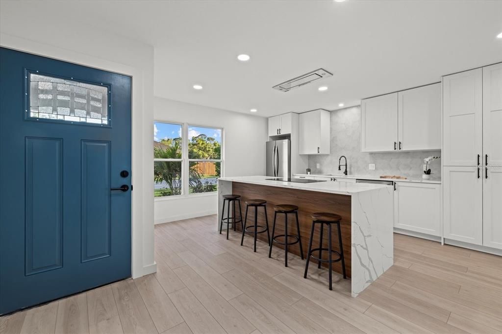 Interior, Kitchen, Marble Walls, Recessed Lighting, Stainless Steel Appliances, Wood Texture Flooring