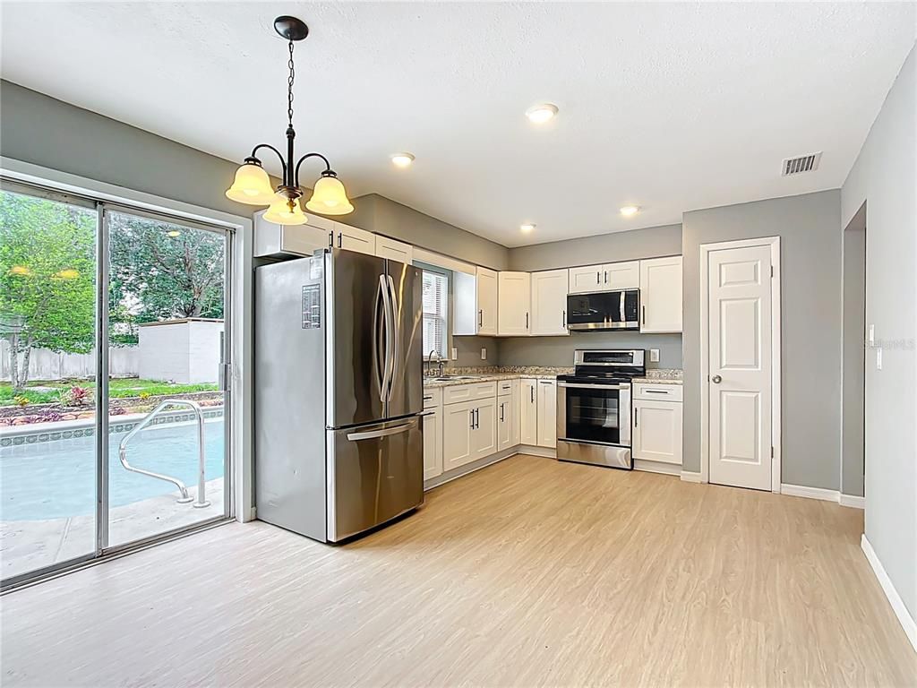 Interior, Kitchen, Pendant Lights, Recessed Lighting, Stainless Steel Appliances, Wood Texture Flooring