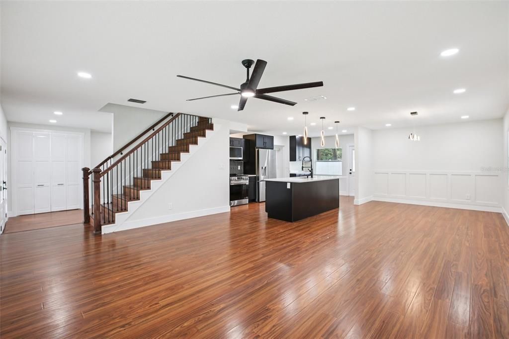 Empty room, Interior, Kitchen, Pendant Lights, Recessed Lighting, Stainless Steel Appliances, Wood Texture Flooring