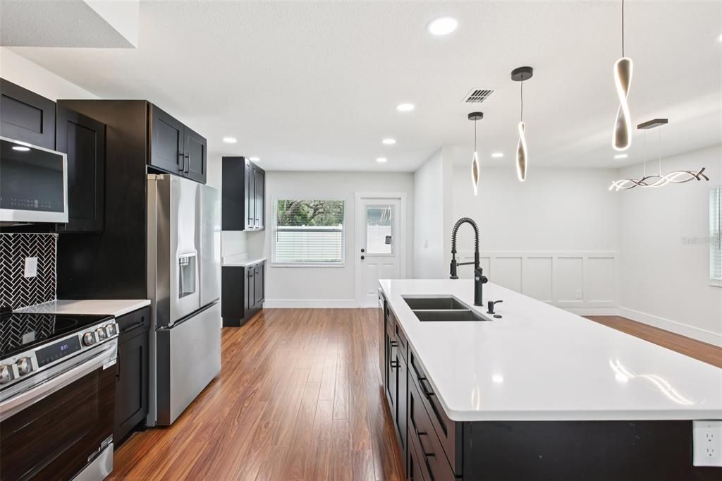 Interior, Kitchen, Pendant Lights, Recessed Lighting, Stainless Steel Appliances, Wood Texture Flooring