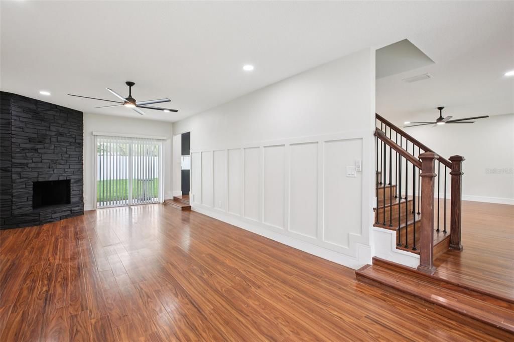 Empty room, Fireplace, Interior, Recessed Lighting, Stone Walls, Wood Texture Flooring