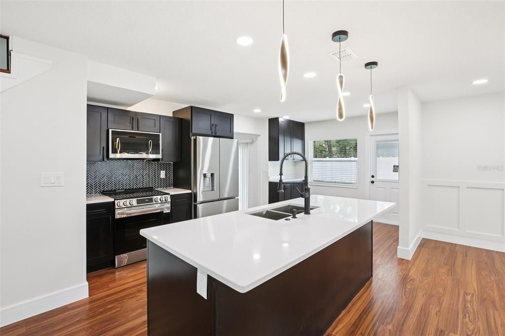Interior, Kitchen, Pendant Lights, Recessed Lighting, Stainless Steel Appliances, Wood Texture Flooring