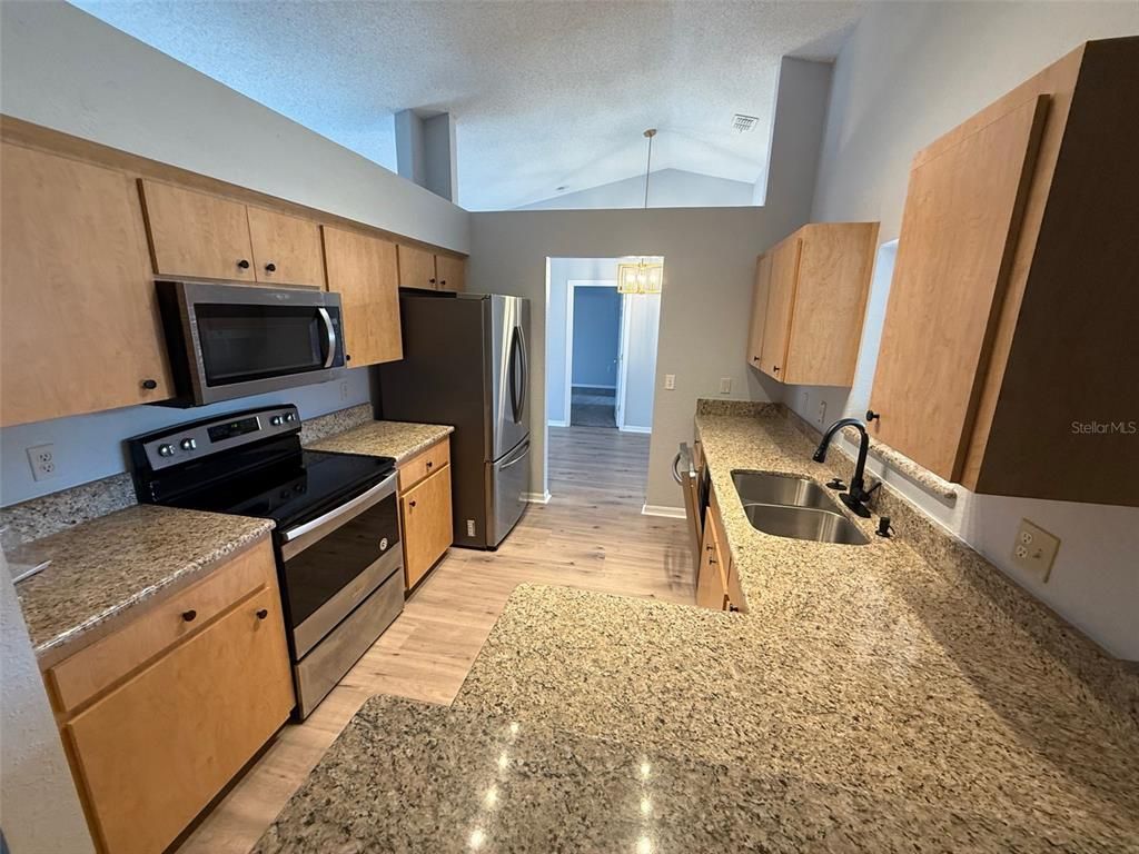 Chandelier, Interior, Kitchen, Pendant Lights, Stainless Steel Appliances, Wood Texture Flooring