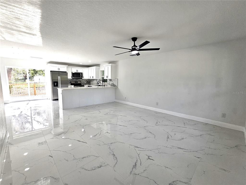 Empty room, Interior, Kitchen, Marble, Recessed Lighting, Stainless Steel Appliances