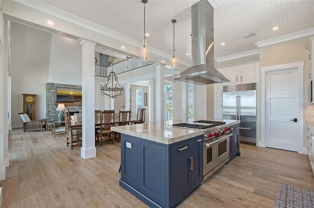 Chandelier, Dining room, Interior, Kitchen, Pendant Lights, Recessed Lighting, Stainless Steel Appliances, Wood Texture Flooring