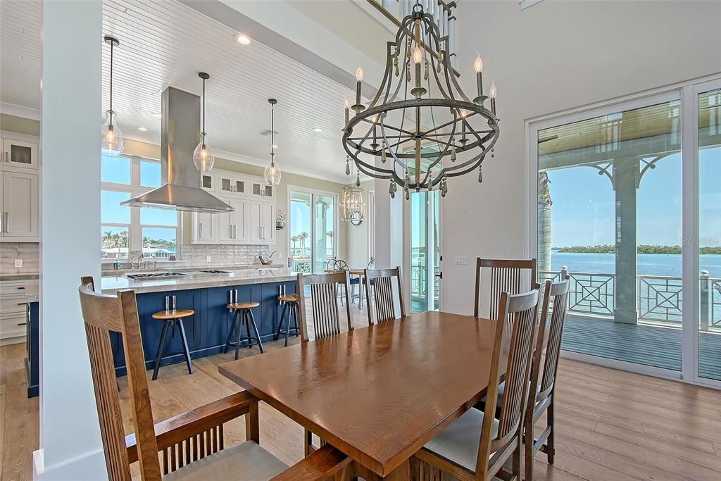 Chandelier, Dining room, Interior, Kitchen, Pendant Lights, Recessed Lighting, Water, Wood Texture Flooring