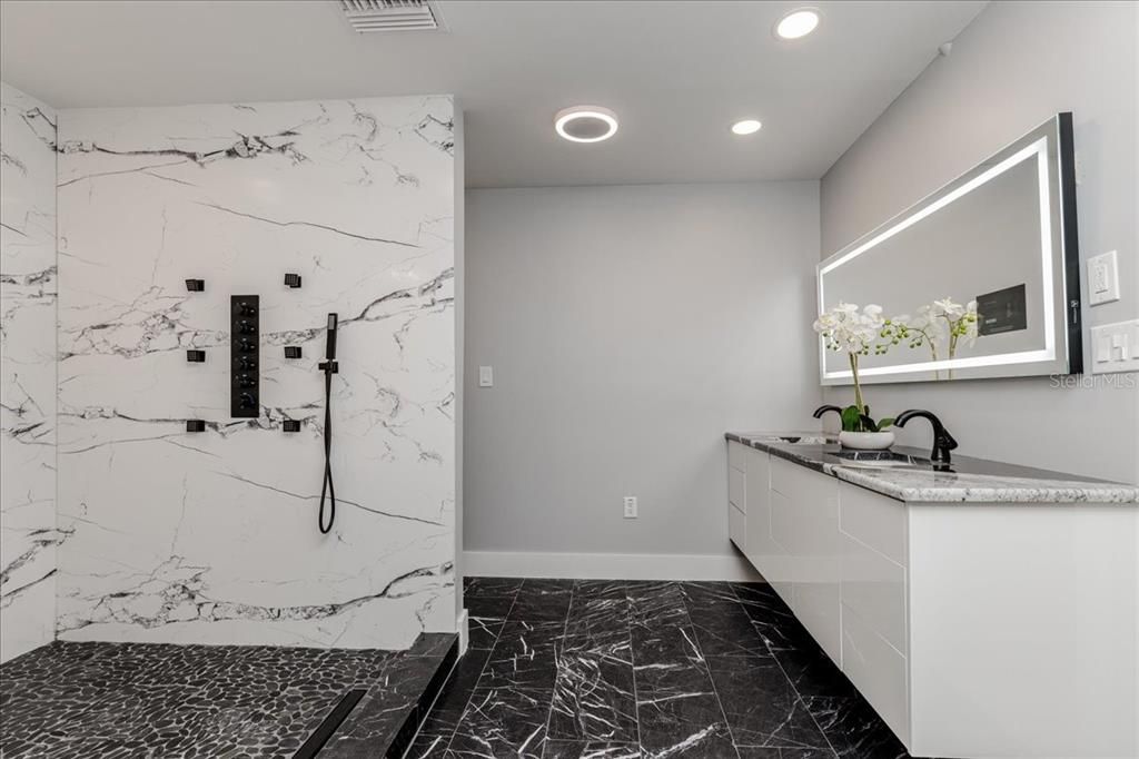 Bathroom, Dual Sink Vanities, Interior, Marble, Marble Walls, Recessed Lighting