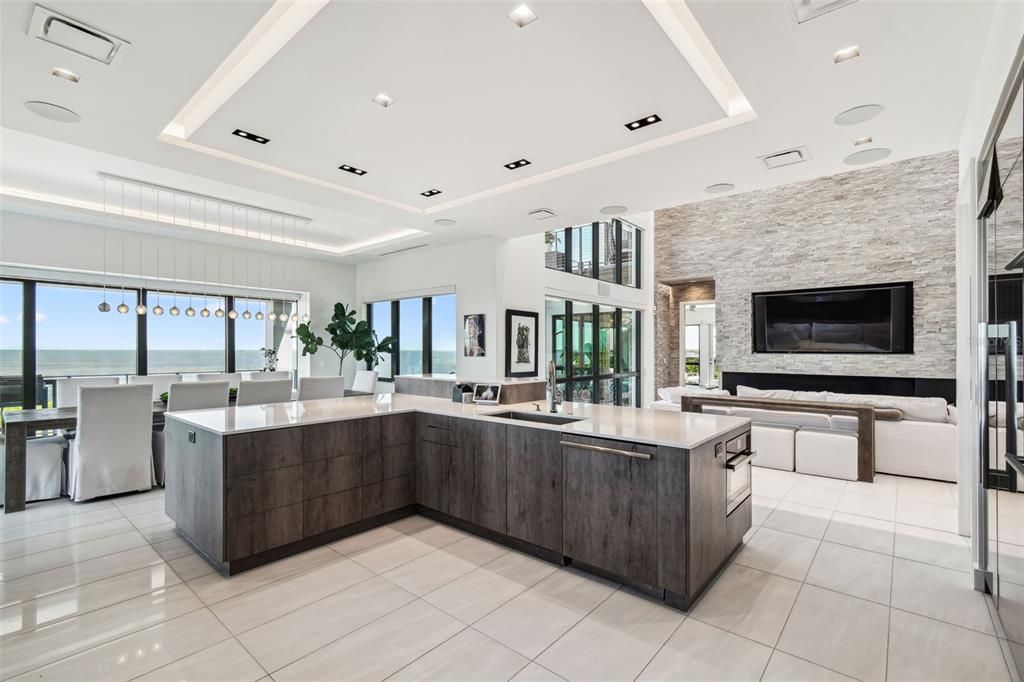 Dining room, Fireplace, Interior, Kitchen, Living room, Pendant Lights, Recessed Lighting, Stainless Steel Appliances, Stone Walls, Water