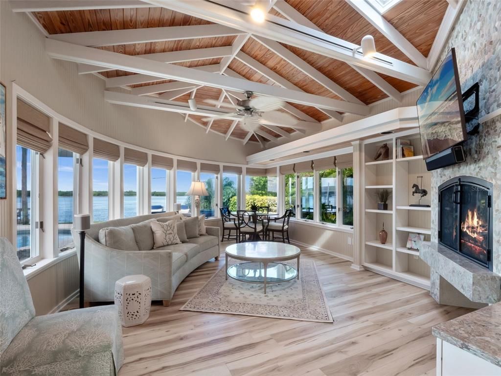 Dining room, Fireplace, Interior, Living room, Stone Walls, Water, Wooden Ceilings, Wood Texture Flooring