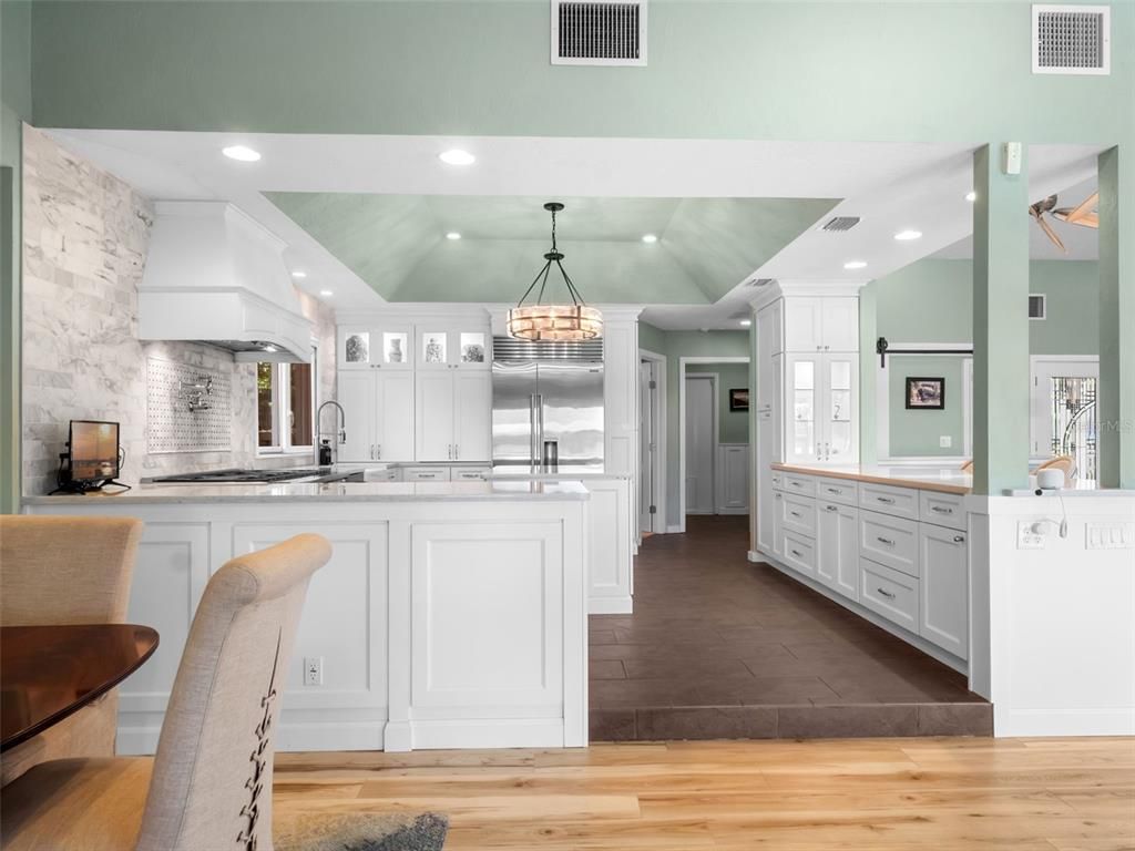 Chandelier, Interior, Kitchen, Pendant Lights, Recessed Lighting, Stainless Steel Appliances, Wood Texture Flooring
