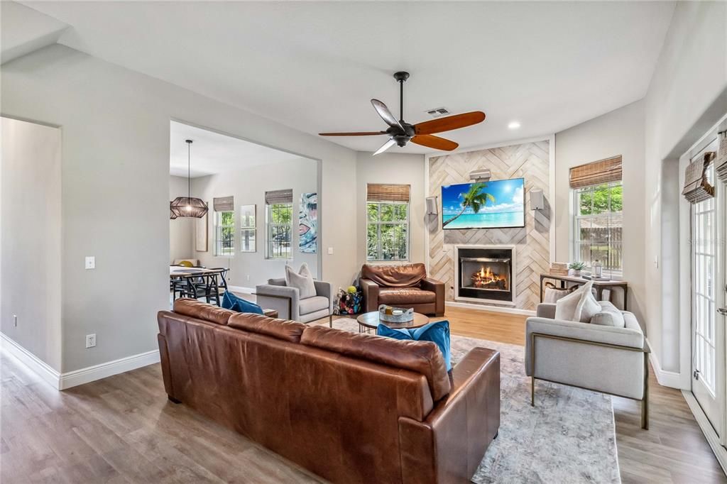 Dining room, Fireplace, Interior, Living room, Pendant Lights, Recessed Lighting, Wood Texture Flooring