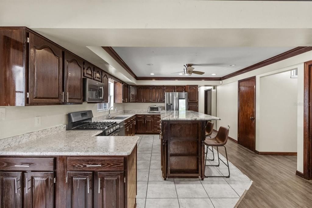 Interior, Kitchen, Recessed Lighting, Stainless Steel Appliances, Wood Texture Flooring