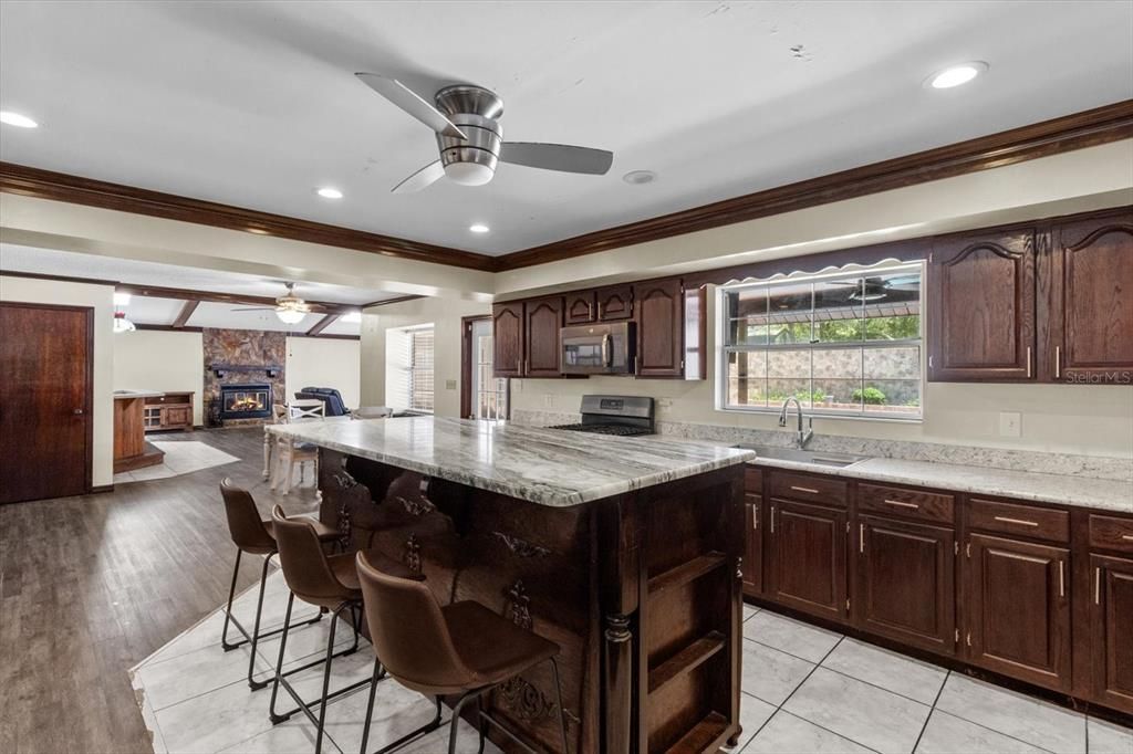 Fireplace, Interior, Kitchen, Recessed Lighting, Wood Texture Flooring