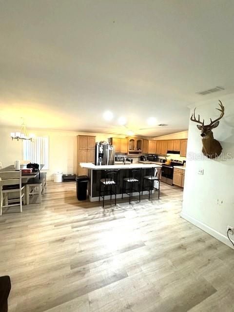 Dining room, Interior, Kitchen, Pendant Lights, Stainless Steel Appliances, Wood Texture Flooring