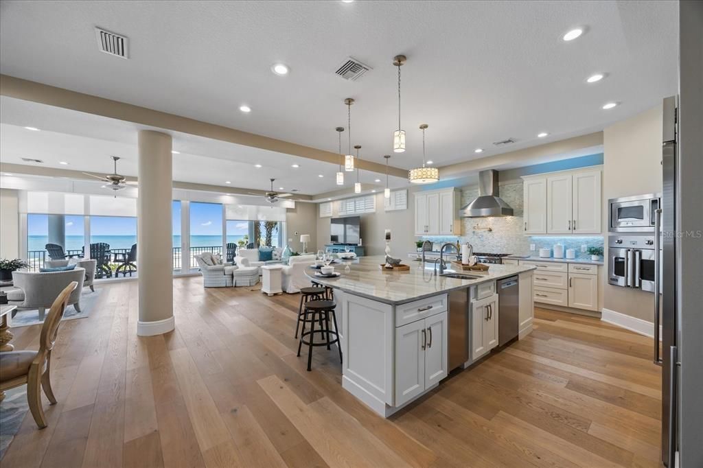 Dining room, Interior, Kitchen, Living room, Pendant Lights, Recessed Lighting, Stainless Steel Appliances, Water, Wood Texture Flooring