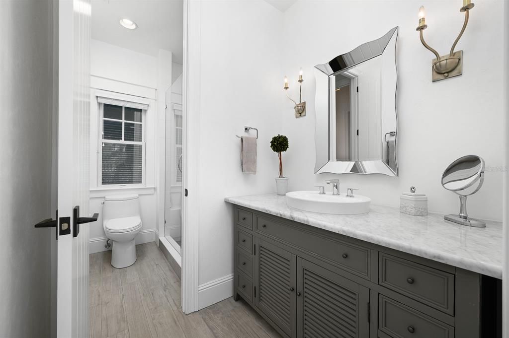 Bathroom, Dual Sink Vanities, Interior, Recessed Lighting, Wood Texture Flooring