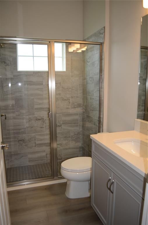 Bathroom, Glass Shower, Interior, Marble Walls, Wood Texture Flooring