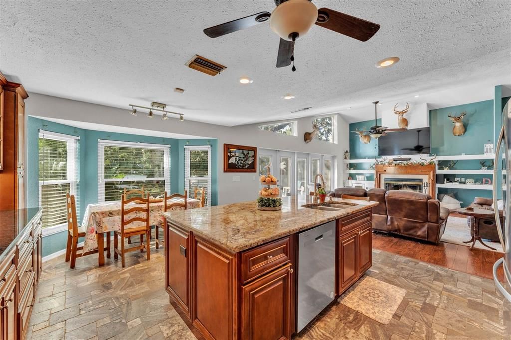 Dining room, Fireplace, Interior, Kitchen, Living room, Recessed Lighting, Wood Texture Flooring