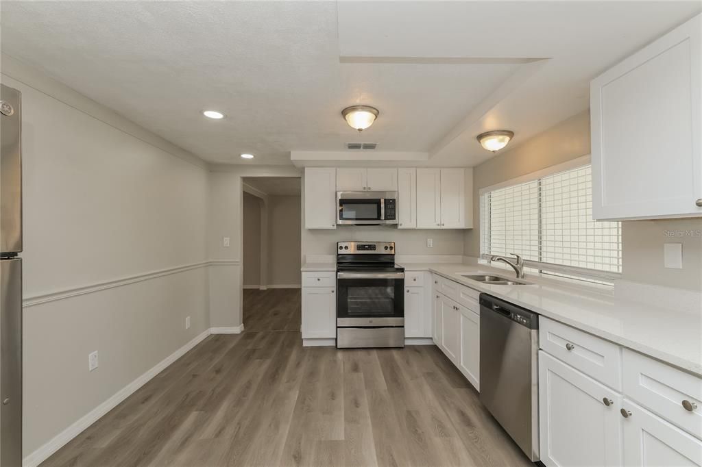 Interior, Kitchen, Recessed Lighting, Stainless Steel Appliances, Wood Texture Flooring