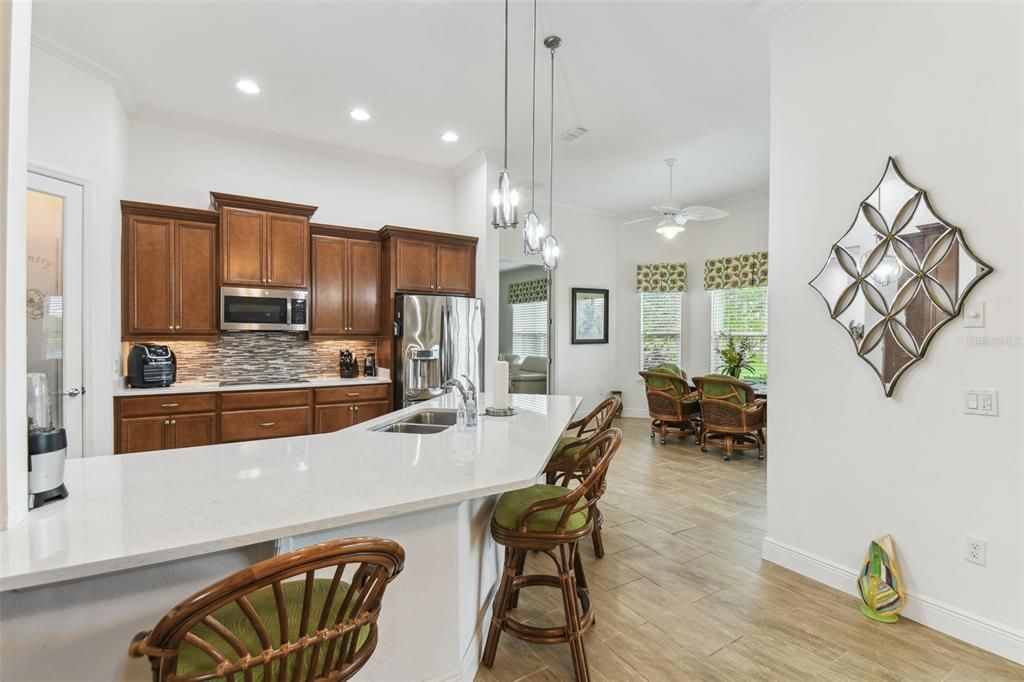 Dining room, Interior, Kitchen, Pendant Lights, Recessed Lighting, Stainless Steel Appliances, Wood Texture Flooring