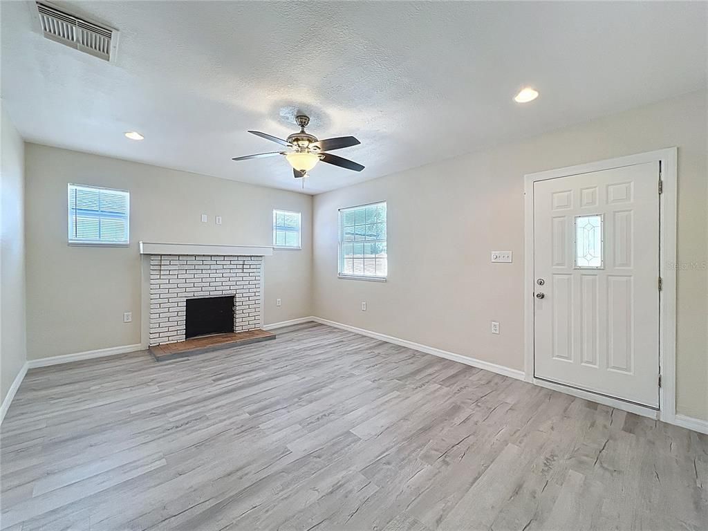 Empty room, Fireplace, Interior, Recessed Lighting, Wood Texture Flooring
