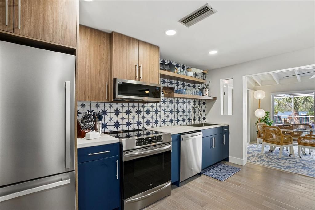 Dining room, Interior, Kitchen, Recessed Lighting, Stainless Steel Appliances, Wood Texture Flooring