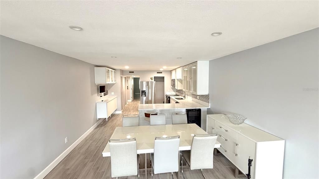 Dining room, Interior, Kitchen, Recessed Lighting, Stainless Steel Appliances, Wood Texture Flooring