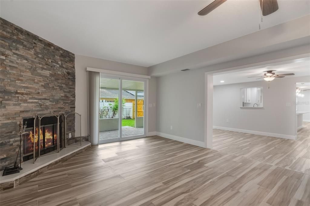 Empty room, Fireplace, Interior, Recessed Lighting, Stone Walls, Wood Texture Flooring