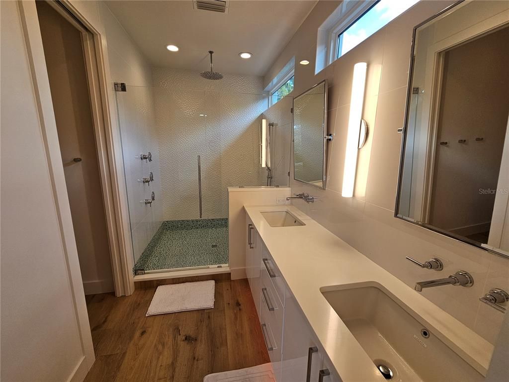 Bathroom, Dual Sink Vanities, Glass Shower, Interior, Recessed Lighting, Wood Texture Flooring