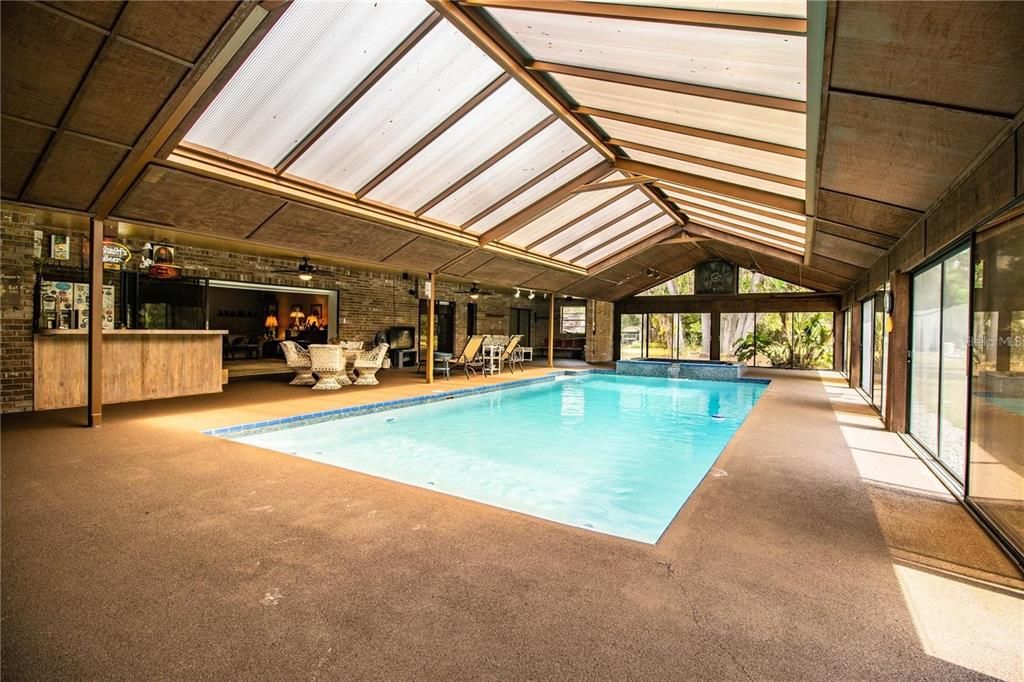 Fireplace, Glass Ceilings, Interior, Pool, Stone Walls, Sun Room