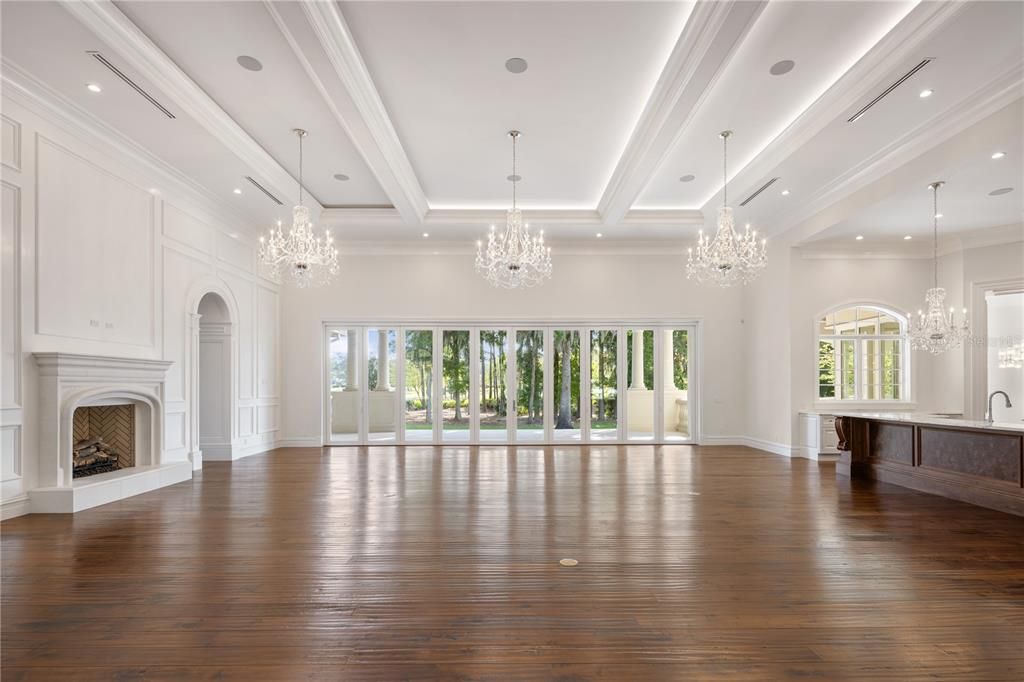 Chandelier, Empty room, Fireplace, Interior, Recessed Lighting, Wood Texture Flooring