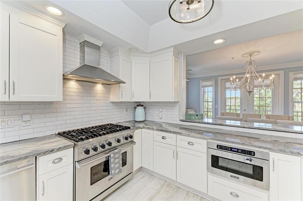 Chandelier, Interior, Kitchen, Recessed Lighting, Stainless Steel Appliances, Wood Texture Flooring